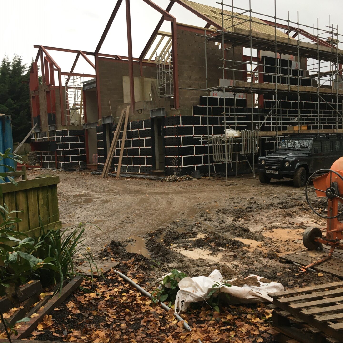 External view of a large residential building under construction.
